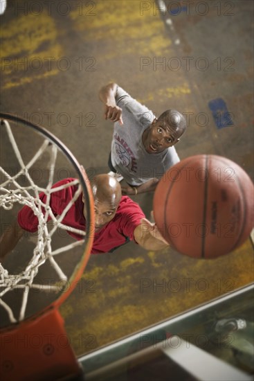 Men playing basketball