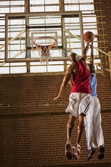 Men playing basketball