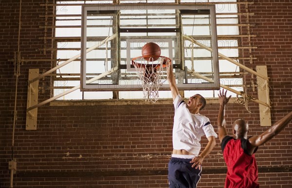 Men playing basketball