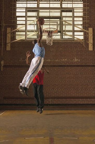 Men playing basketball