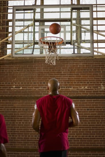 Men playing basketball