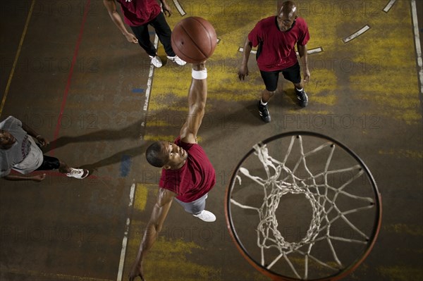 Men playing basketball