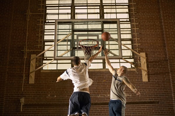 Men playing basketball