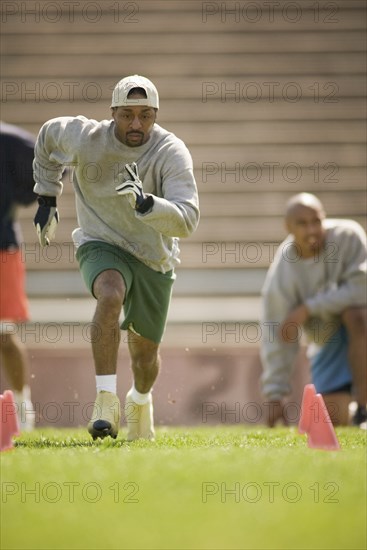 Men training on football field