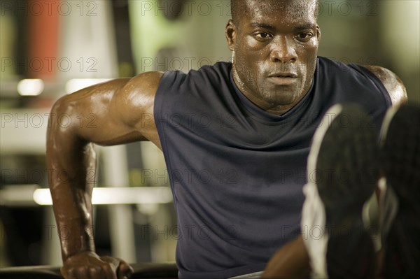 Man exercising in health club