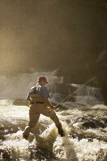 Man fly fishing in river