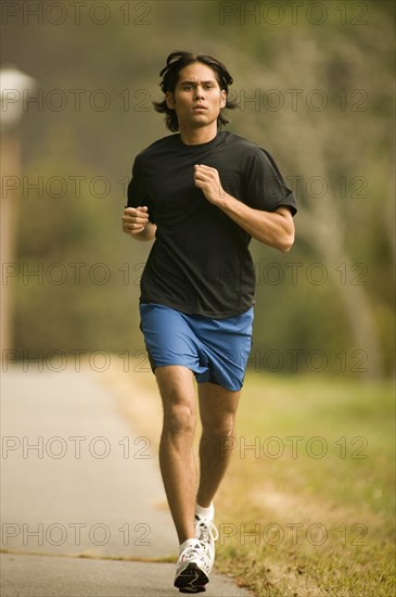 Man jogging on sidewalk