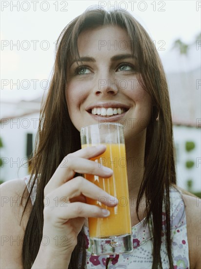 Woman drinking orange juice