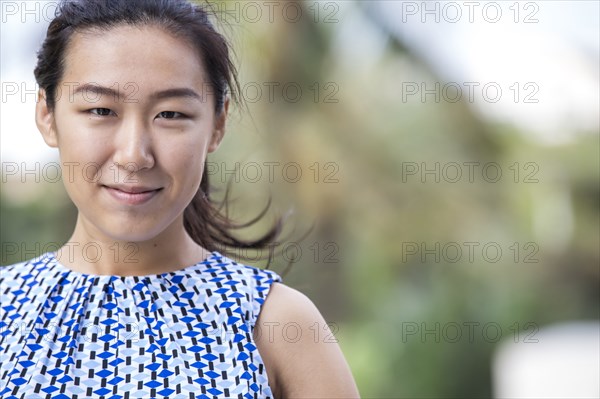 Close up of Asian businesswoman smiling outdoors