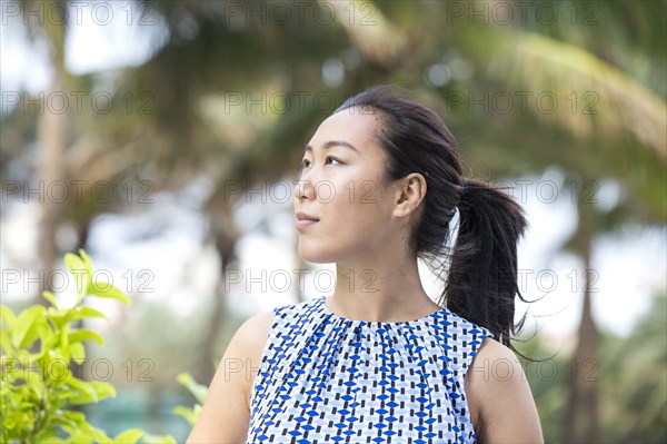 Asian businesswoman smiling outdoors