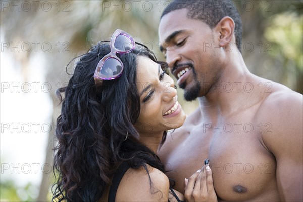 Close up of couple hugging outdoors