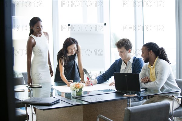 Business people talking in office meeting