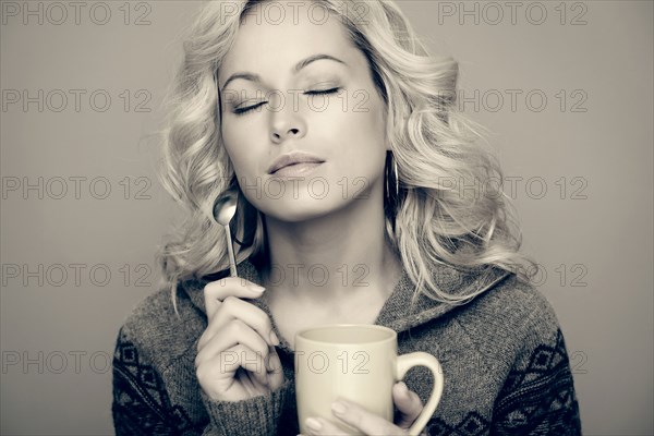 Caucasian woman drinking coffee