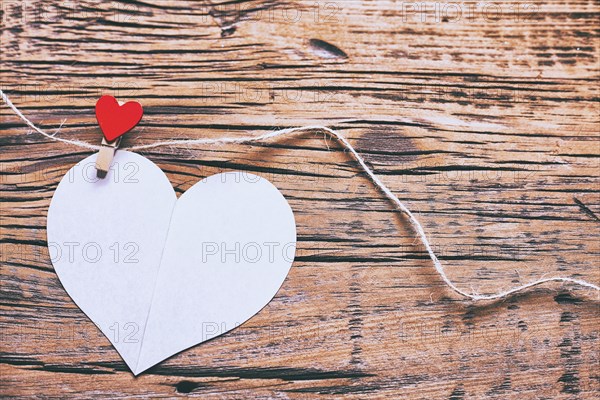 Paper heart hanging on string with clothespin