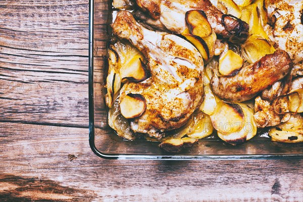 Corner of potato and chicken casserole in baking dish