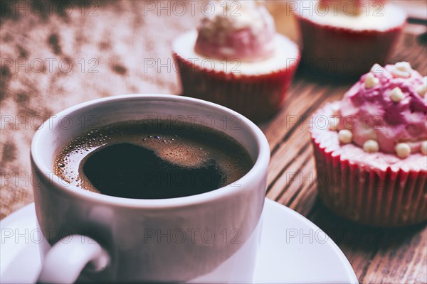 Close up of coffee and cupcakes