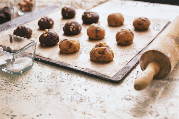 Cookie dough on baking sheet near rolling pin