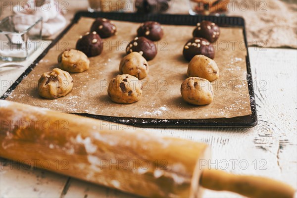 Cookie dough on baking sheet near rolling pin