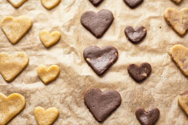 Heart-shape cookies on baking sheet