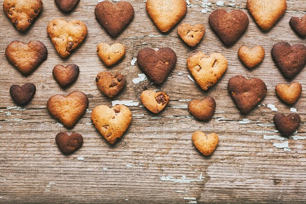 Heart-shape cookies on wooden table