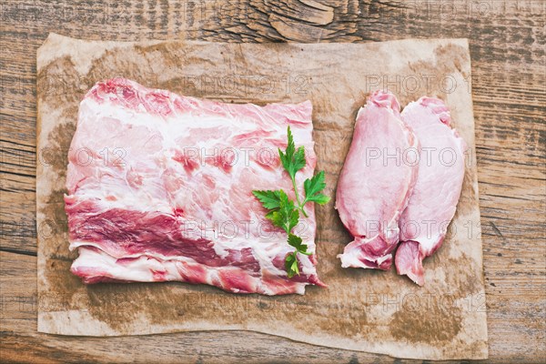 Raw meat and garnish on butcher paper