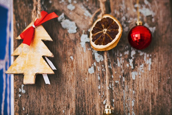 Christmas ornaments hanging on wood