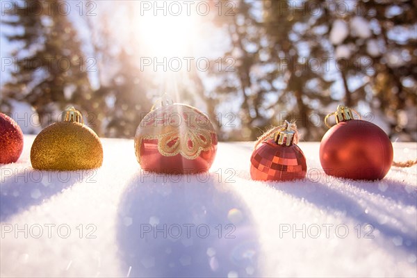 Christmas ornaments in snow