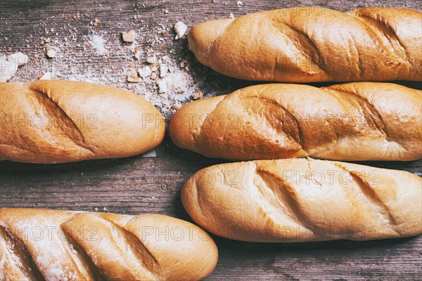 Loaves of bread on wooden table