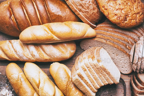 Loaves and sliced bread on table