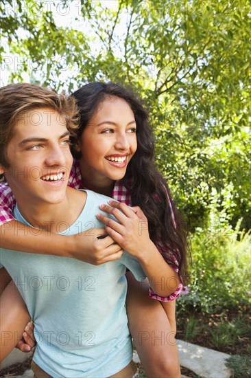 Boyfriend giving girlfriend piggyback ride