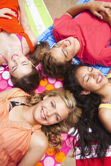 Friends laying outdoors together