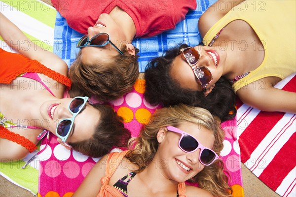 Friends laying outdoors together