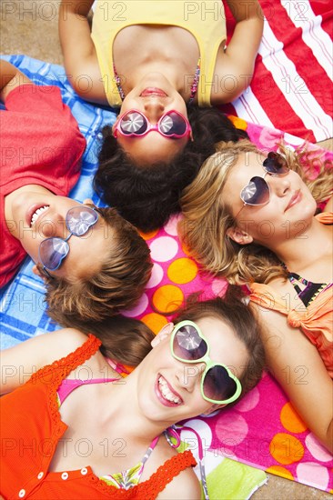 Friends laying outdoors together