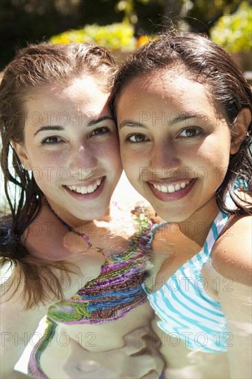 Girls enjoying swimming pool together