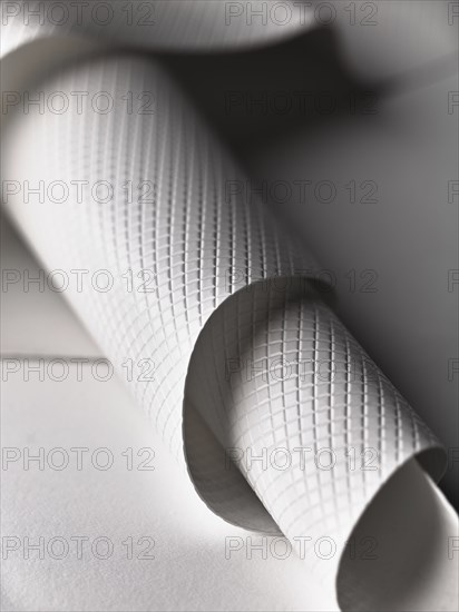 Close up of white rolled plastic sheet