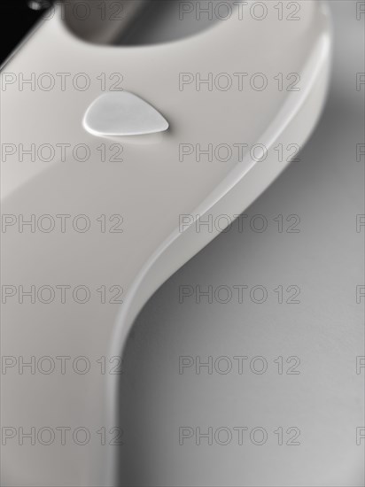 Close up of white electric guitar with guitar pick