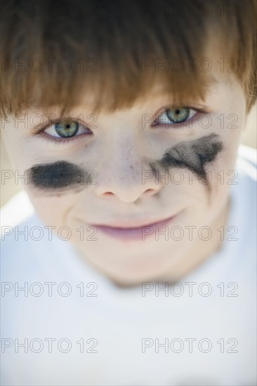 Caucasian baseball player with marks on cheeks