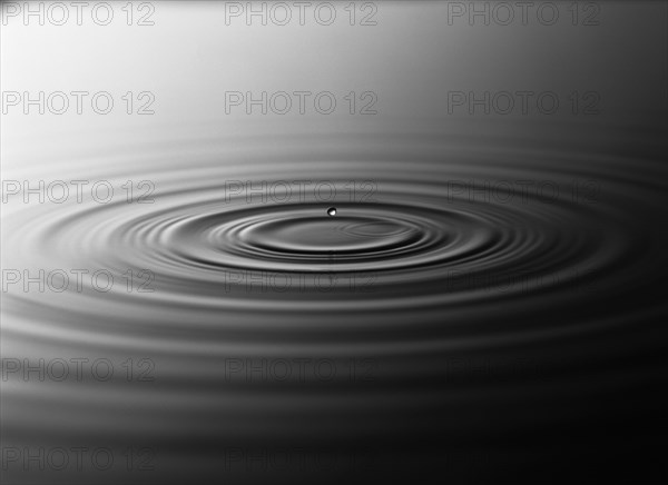 Droplet splashing in rippling water