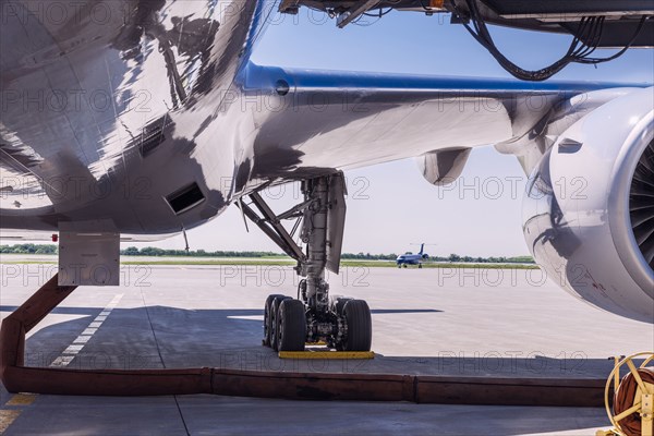 Underbelly of airplane at airport