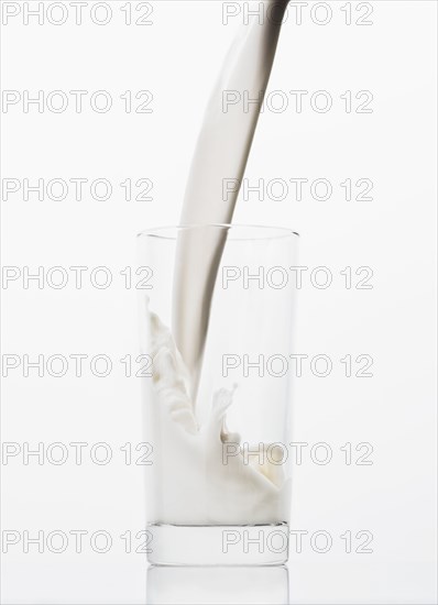 Milk pouring into glass