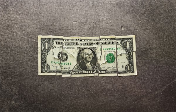 Broken dollar bill