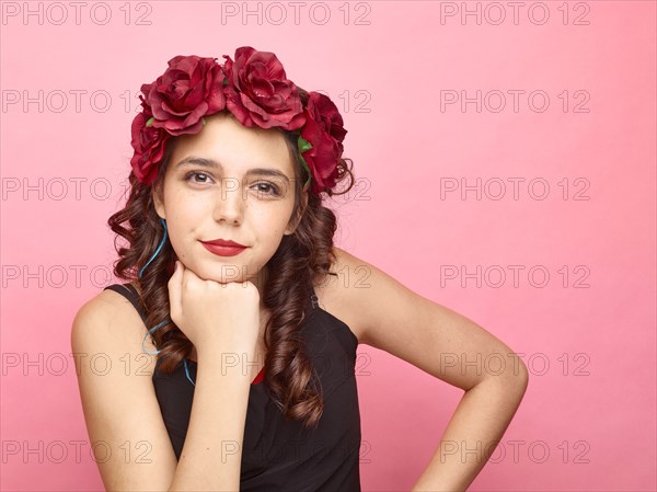 Girl with flowers in hair wearing makeup