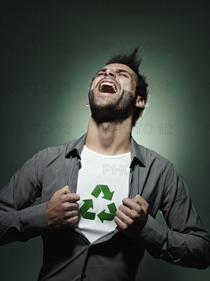 Caucasian man with recycling symbol in his shirt