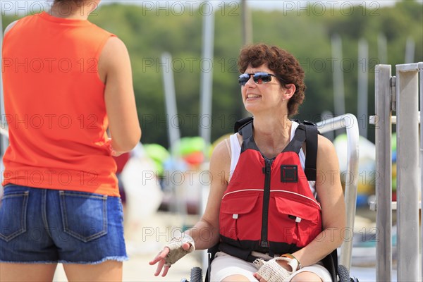 Caucasian women talking at marina