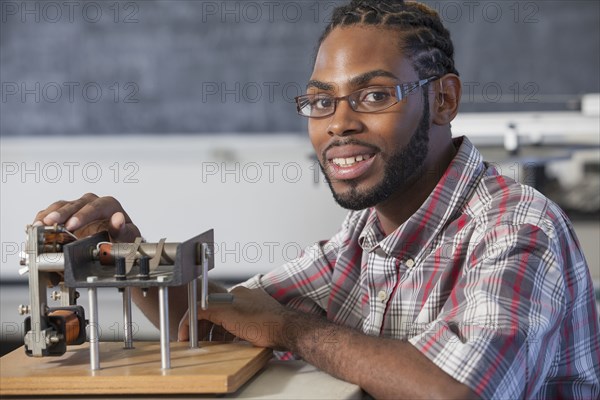 Student performing experiment in science classroom