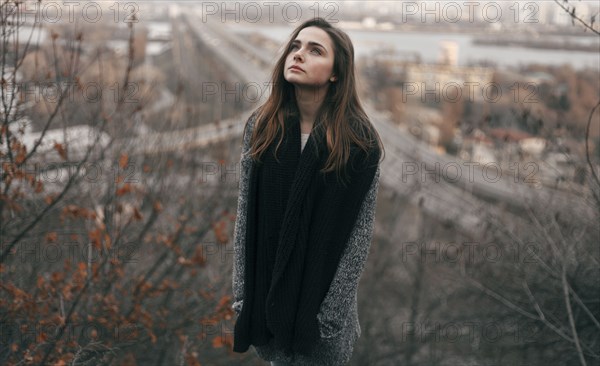 Caucasian woman looking up outdoors