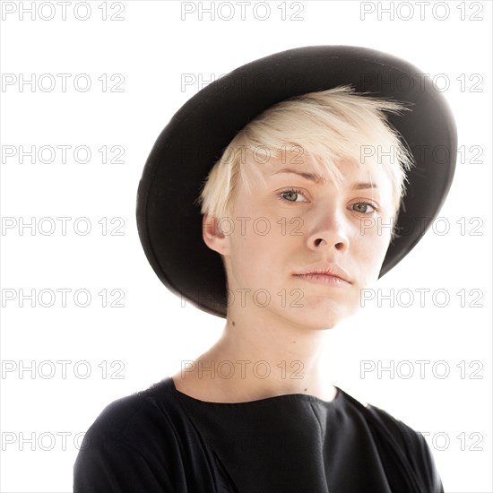 Portrait of serious Caucasian woman wearing hat