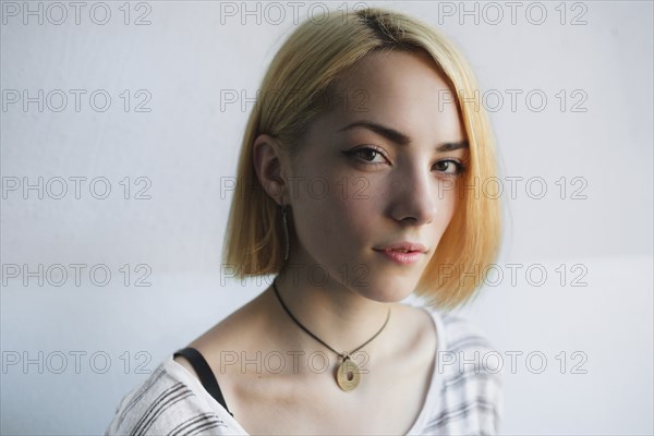 Portrait of serious Caucasian woman with short hair