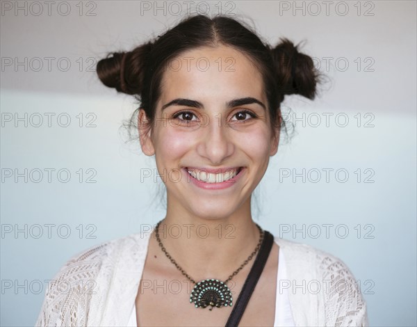 Portrait of smiling Caucasian woman wearing necklace