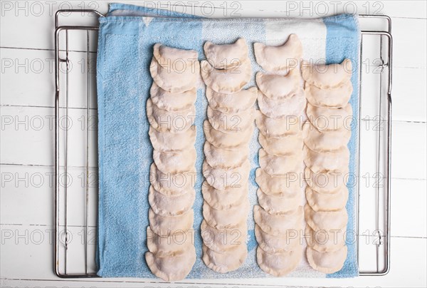 Rows of pierogies on towel